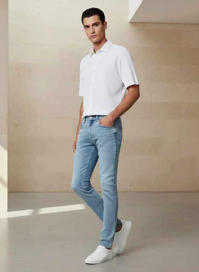 سبلاش فيڤ جينز رجالي بقصة ضيقة وخصر مرن وجيوب